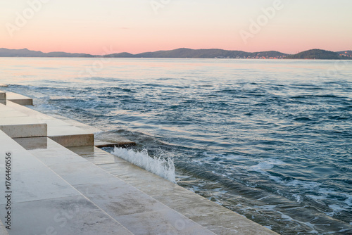 The famous landmark of the sea organ steps with the melody of the dawn in the old town of Zadar, Croatia