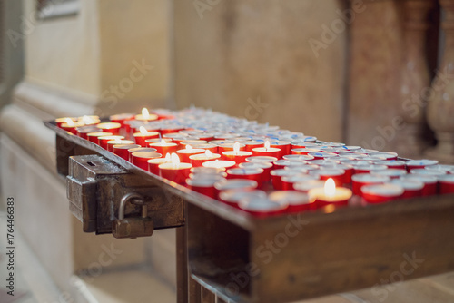 Prayer candles inside a Catholic church.