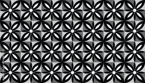 A seamless black and white geometric pattern inspired by floral shapes with petal-like motifs forming circular symmetry. The bold contrast and repetitive design create a stylish and elegant effect