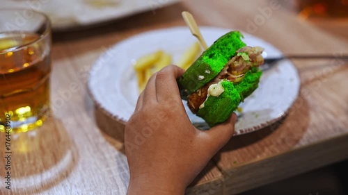 Enjoying colorful sandwich and drink in a cozy cafe