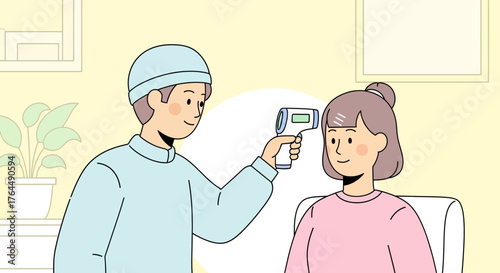 Medical professional checking patients temperature with infrared thermometer.