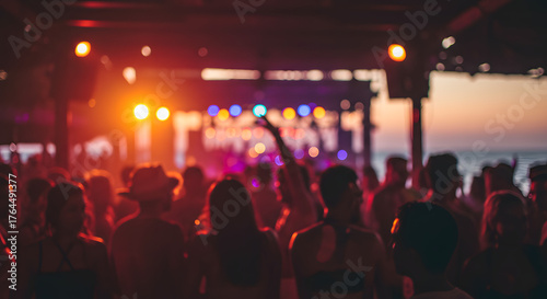 Blurred people having sunset beach party in summer vacation - Defocused image - Concept of nightlife with cocktails and music entertainment