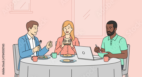 Diverse group of colleagues enjoying a meal together at a round table.