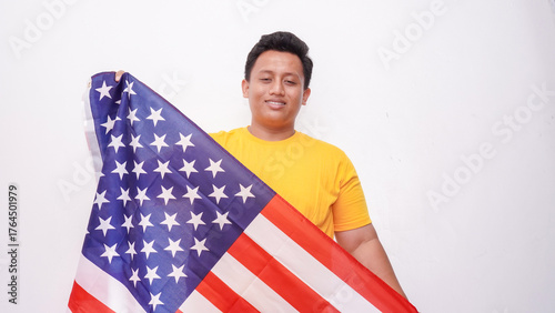 Asian Fat Man holding USA flag at studio against white background.