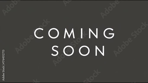 Minimalist COMING SOON text stands out in a bold clean font on gray background. Camera zooms in and out slowly to create motion.