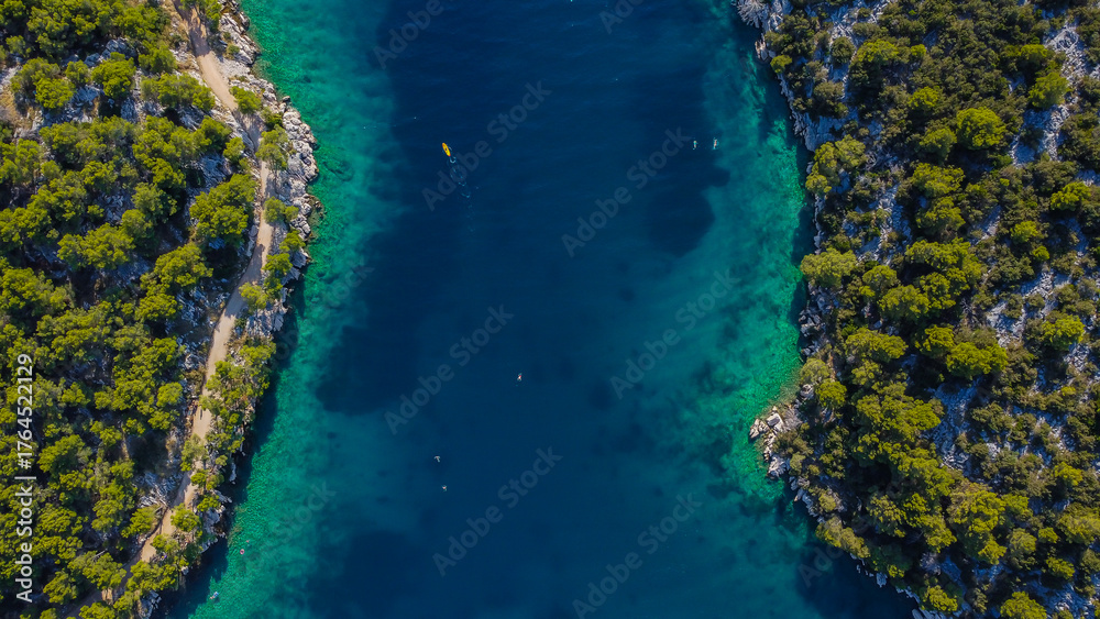 Fototapeta premium Aerial seascape with clear blue and green tones