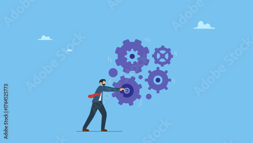 Smart businessman manager use all his power and skill to rotate group of cogwheels gear. Business work flow, leadership to drive team and initiate productivity and efficiency working process.