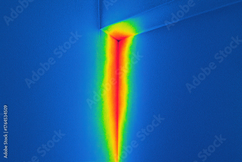 Thermal infrared image of heat loss through window corner, energy efficiency audit, heat leakage detection in building envelope