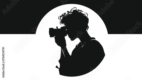 Professional photographer silhouette with camera, focusing on a shot against a dramatic black and white background with circular element.