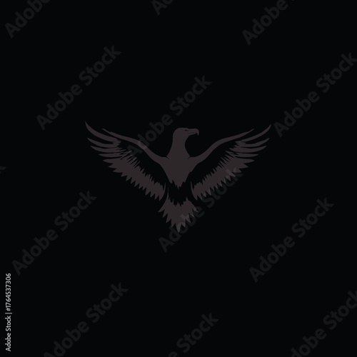 Majestic dark grey eagle silhouette soaring with wings spread, powerful bird of prey in flight, minimalist vector graphic design on black background.