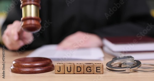 Observing courtroom procedures with a focus on a judge s gavel striking and the solemnity of justice in action