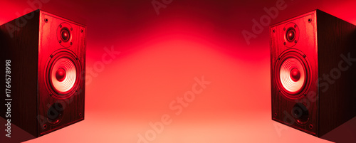 A banner with two speakers on the edges and a free space in the center for your design. Red neon lighting.