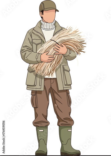 Farmer holding a bundle of harvested wheat stalks.