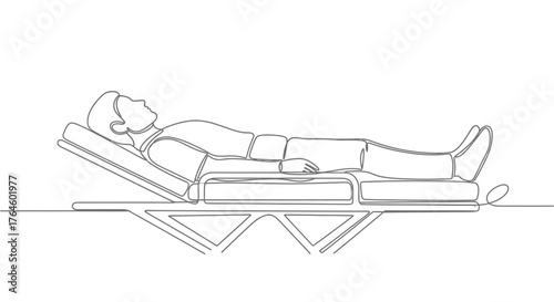 Person lying on an adjustable bed in a relaxed position  