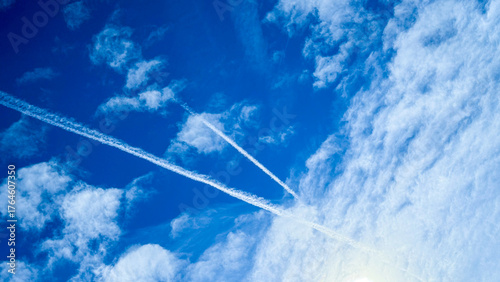 Canvastavla Cobalt sky tapestry painted with ethereal contrails, embodying wanderlust's zest