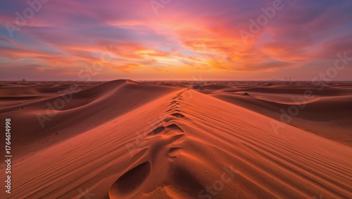 Fototapeta Naklejka Na Ścianę i Meble -  Sunset view of a singing sand dune in a desert landscape