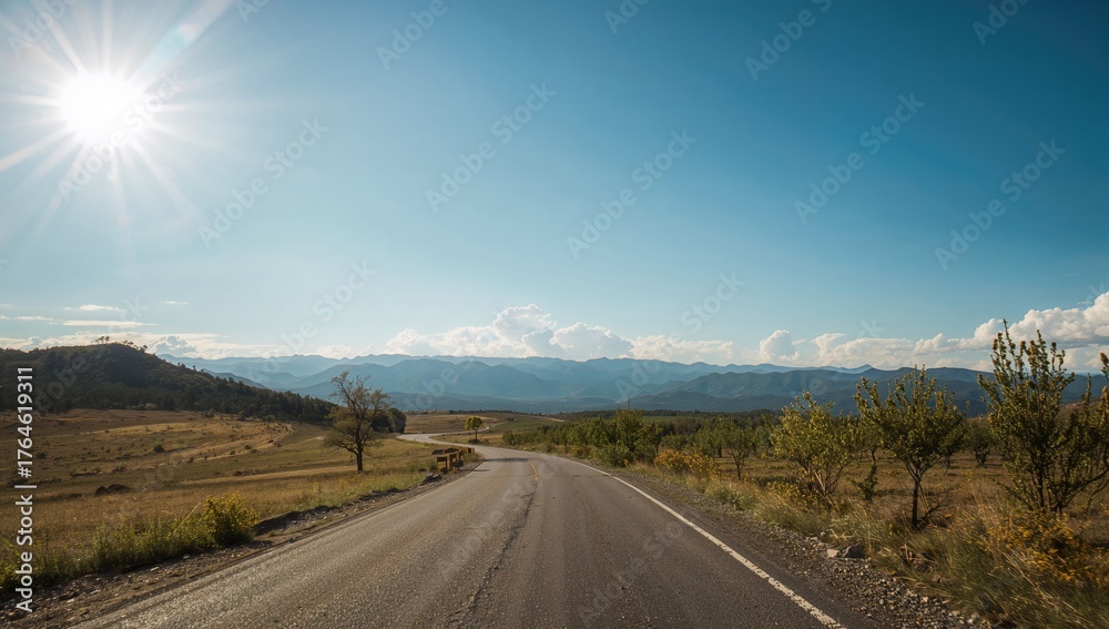 Naklejka premium Extended pathway leading to distant peaks