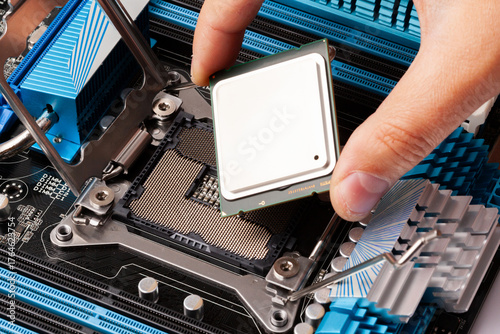 Hand Installing Processor Chip on Motherboard for Computer Upgrade