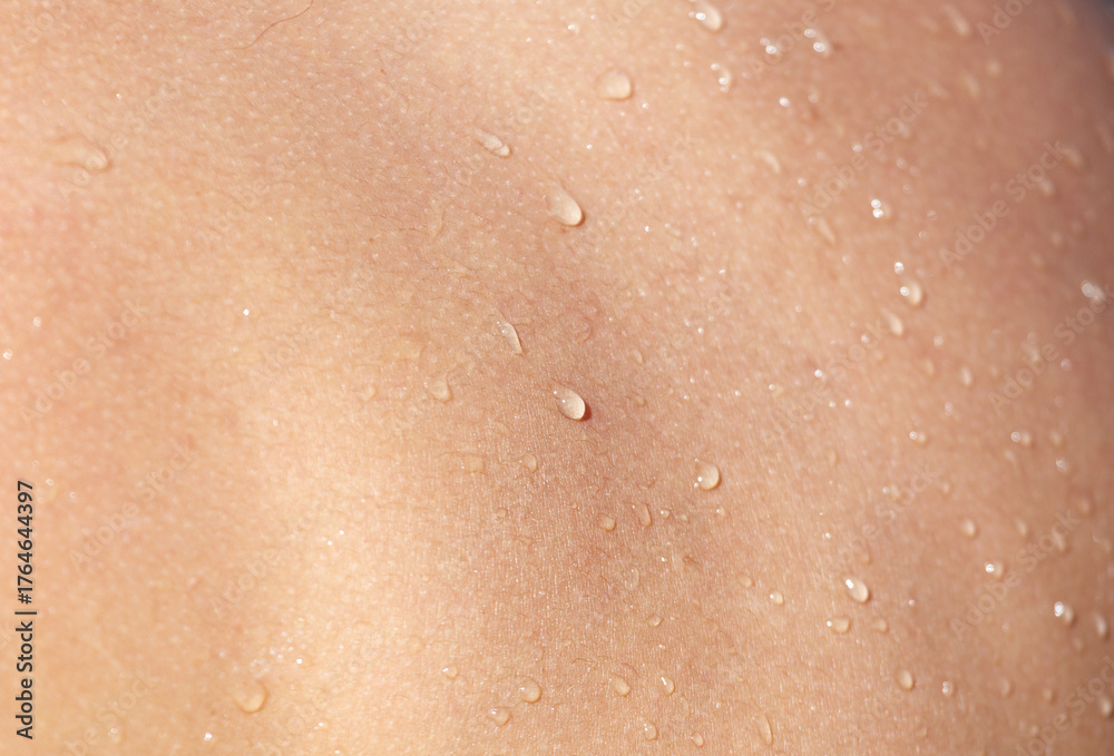 Fototapeta premium A person's back is wet with water