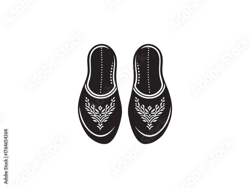 Traditional black embellished footwear pair top view rustic folk style shoes isolated silhouette