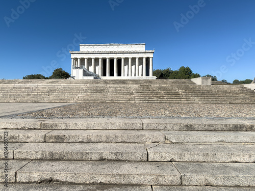 Lincoln Memorial in Washington DC on a sunny day with blue sky and tourists