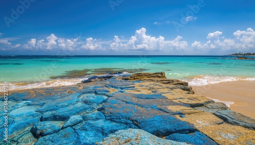 Fototapeta Naklejka Na Ścianę i Meble -  Blue and yellow colored stones by the ocean