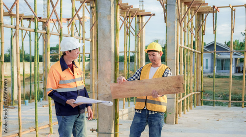 Diverse Team of Specialists Use Tablet Computer on Construction Site. Real Estate Building Project with Civil Engineer, Architect, Business Investor and General Worker Discussing Plan Details.