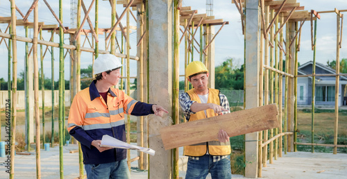 Diverse Team of Specialists Use Tablet Computer on Construction Site. Real Estate Building Project with Civil Engineer, Architect, Business Investor and General Worker Discussing Plan Details.