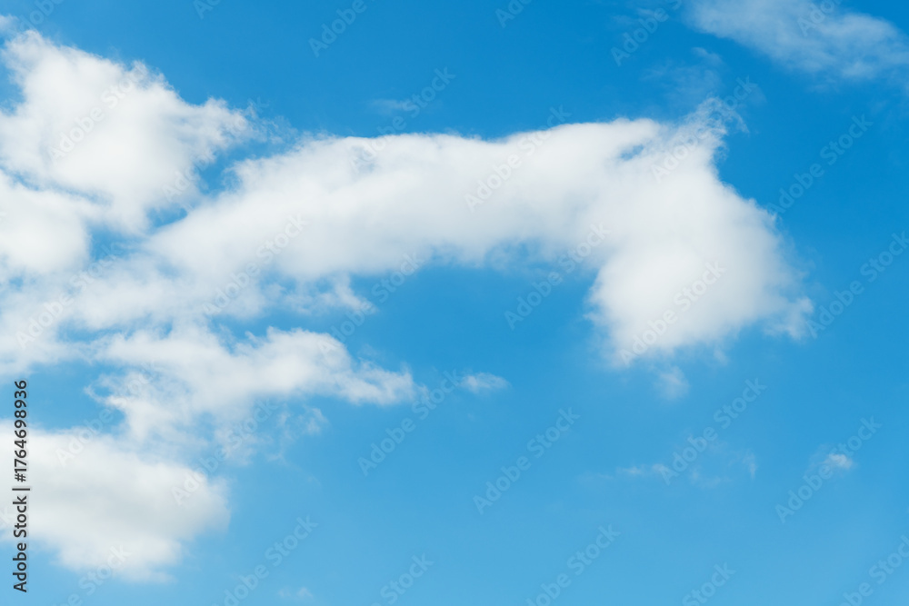 Fototapeta premium Background of blue sky with some white clouds