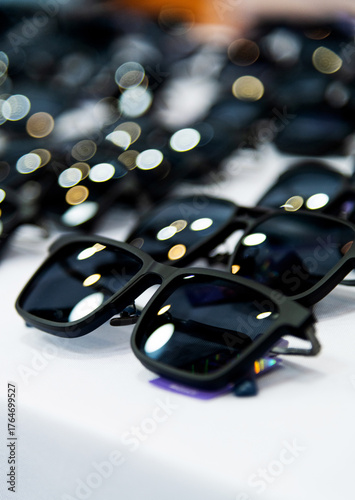 Many sunglasses are displayed in the store