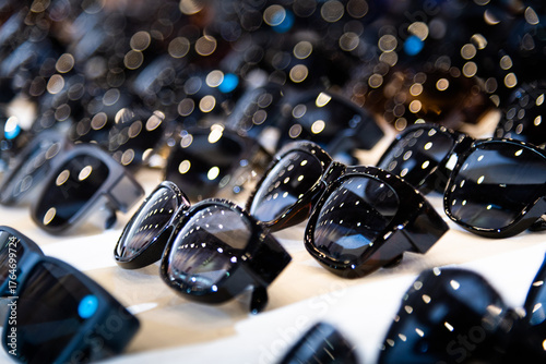 Many sunglasses are displayed in the store
