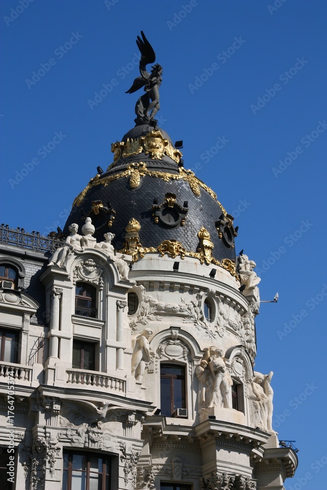 Fototapeta premium Metropolis building in Madrid city, Spain. Architecture of Madrid, Spain. Romanesque Revival old architecture style.
