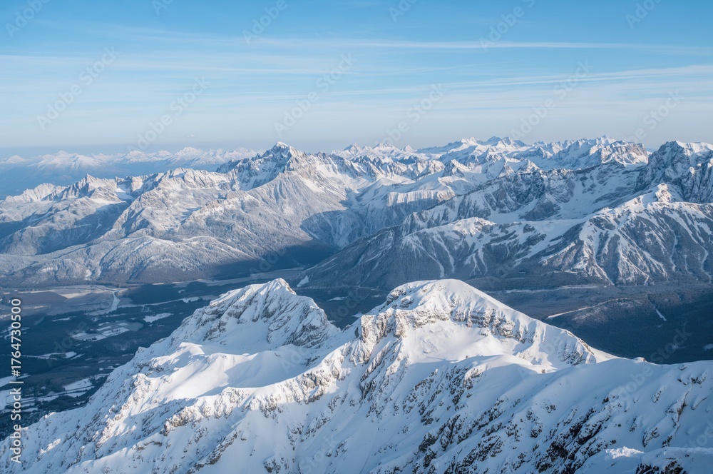 Naklejka premium Snow-covered peaks in a European mountain range, winter landscape, alpine sports, mountain summits, adventure sports spot, winter vacation destination, mountainous scenery