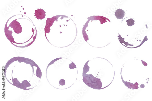 Real wine stains and glass ring marks on white background. Red vine glass stains set. Artistic grape juice spill texture for food and drink design