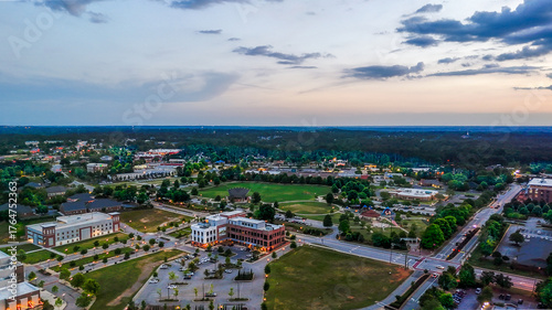 Bild auf Leinwand Aerial sunset landscape from Evans Town Center Park summer sunset in CSRA August