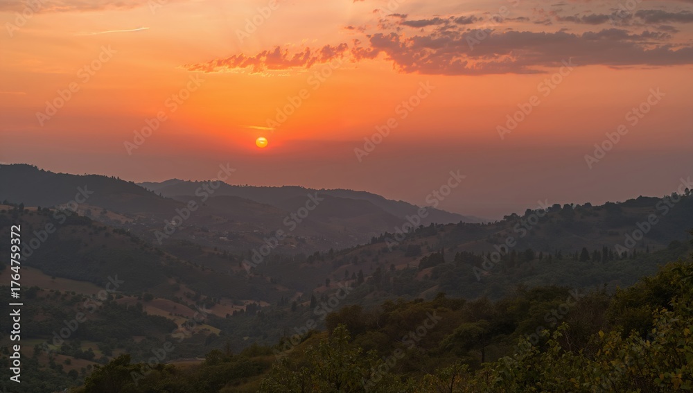 Fototapeta premium Twilight casting a warm glow on a mountainous valley