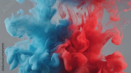 Abstract Dual Smoke Flow – Blue and Red Smoke Swirling Gracefully on Gray Background