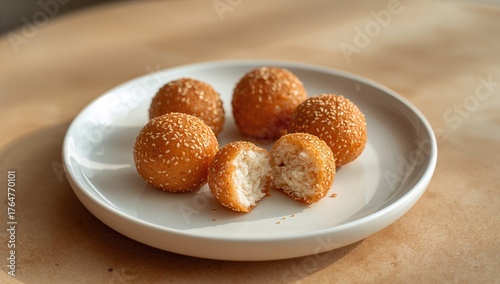 Sesame seed balls on a whit...