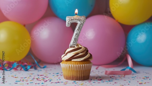 Cupcake with a candle celeb...