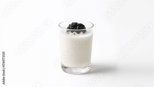 Glass of milk with grass je...