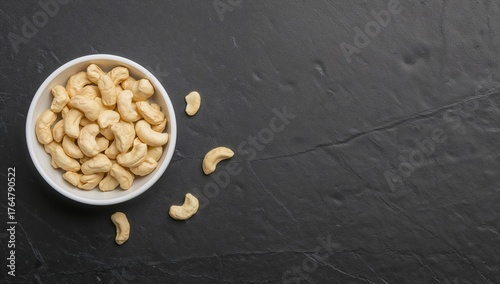 Raw cashew nuts served in a...