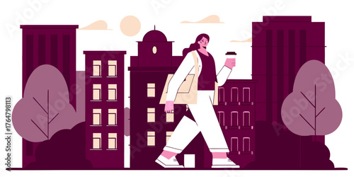 Fashionable woman walking through city streets with coffee in hand.