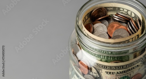 Day of goodwill celebration with a jar of coins and cash for charity contributions and savings concepts
