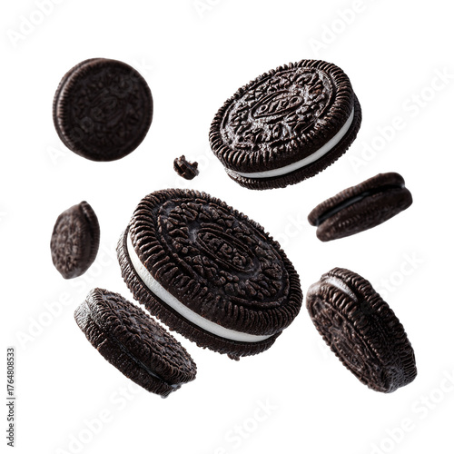 Floating oreo cookies with crumbs on a black background in a studio shot with bright lighting setup