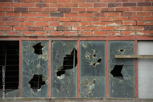 Konstfotografi Broken glass windows in an abandoned building, showcasing shattered panes and br