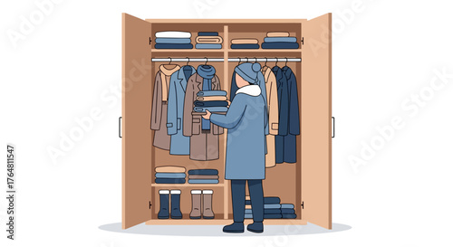 Person wearing blue coat and hat standing in front an open wardrobe filled with winter clothes, organizing and selecting outfits