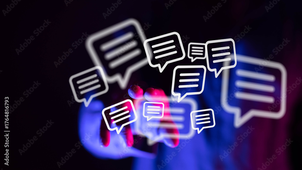 Fototapeta premium Hand reaching out to glowing message bubbles, representing digital communication, connection, and online interaction. Perfect for tech, social m