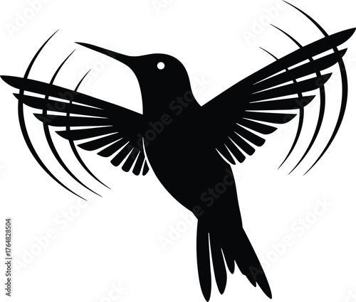hummingbird hovering mid-air with wings blurred in motion silhouette