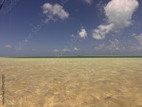 Obraz na plátne Crystal-clear turquoise waters lap onto a pristine white sand shoreline on Kiritimati (Christmas Island), Kiribati