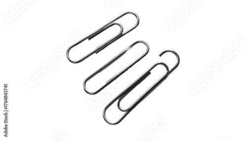 Three silver paperclips are arranged diagonally against a black background, slightly overlapping each other